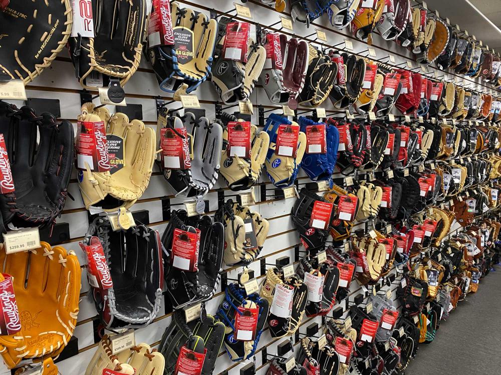 Baseball gloves displayed for sale at Home Run Park